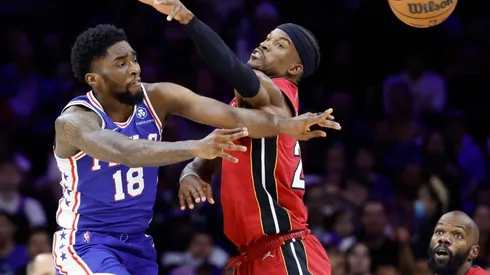 Shake Milton of the Philadelphia 76ers passes the ball against Jimmy Butler of the Miami Heat