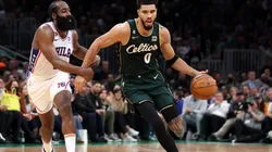 James Harden #1 of the Philadelphia 76ers defends Jayson Tatum #0 of the Boston Celtics