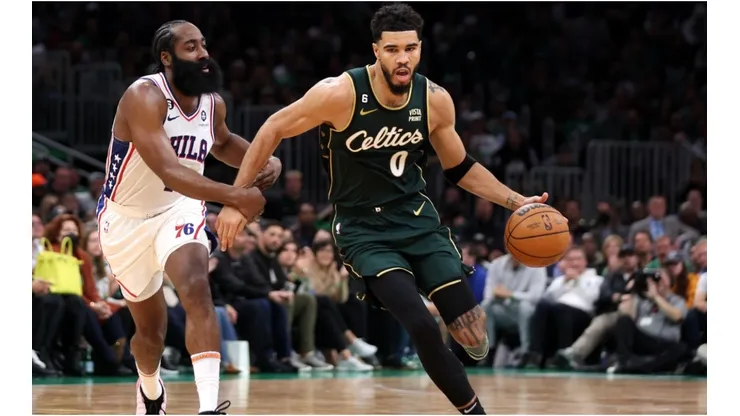 James Harden #1 of the Philadelphia 76ers defends Jayson Tatum #0 of the Boston Celtics