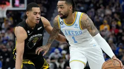 Jordan Poole of the Golden State Warriors and D'Angelo Russell of the Los Angeles Lakers