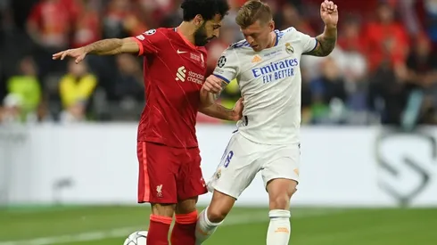 Mohamed Salah of Liverpool battles for possession with Toni Kroos of Real Madrid