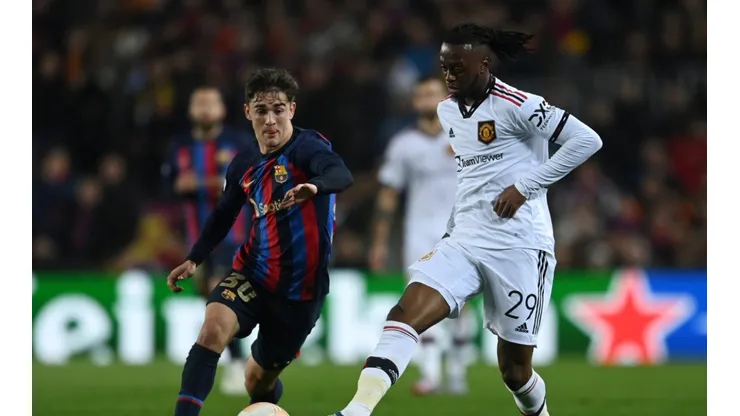 Gavi of FC Barcelona battles for possession with Aaron Wan-Bissaka of Manchester United