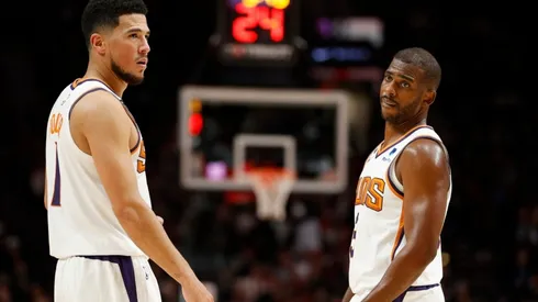 Devin Booker (left) and Chris Paul.