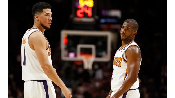 Devin Booker (left) and Chris Paul.