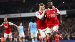 Bukayo Saka of Arsenal celebrates with teammate Martin Odegaard