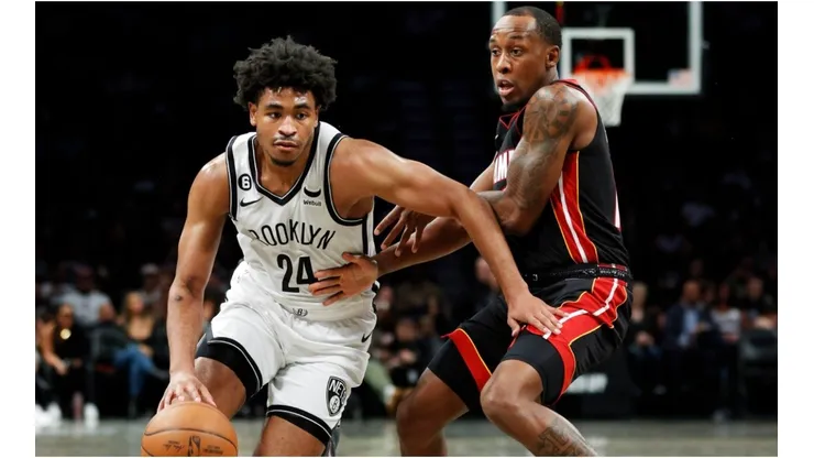 Cam Thomas #24 of the Brooklyn Nets dribbles as Jamaree Bouyea #11 of the Miami Heat