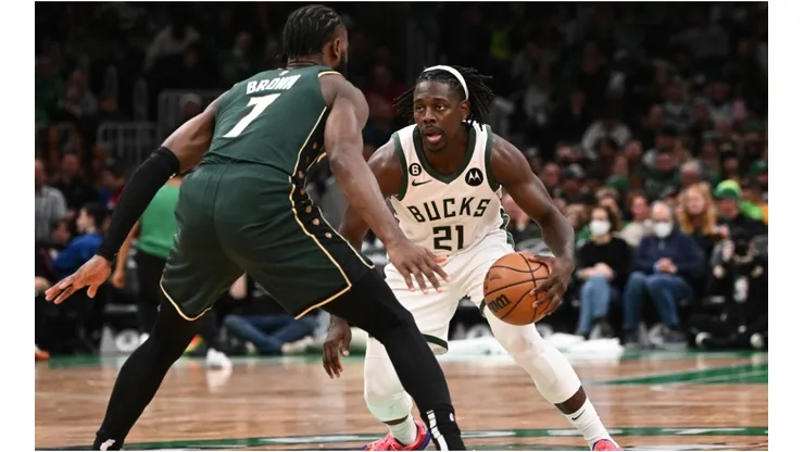 Jrue Holiday #21 of the Milwaukee Bucks dribbles the ball against Jaylen Brown #7 of the Boston Celtics