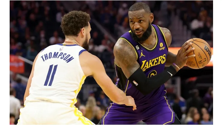 LeBron James #6 of the Los Angeles Lakers is guarded by Klay Thompson #11 of the Golden State Warriors