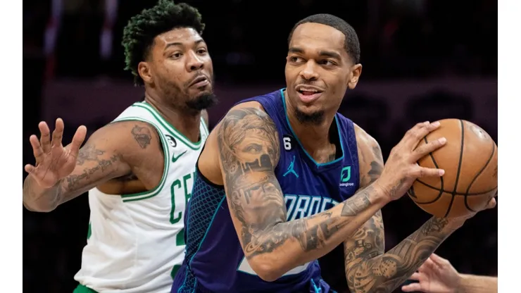 Marcus Smart of the Boston Celtics and J. Washington of the Charlotte Hornets