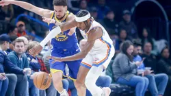Shai Gilgeous-Alexander #2 of the Oklahoma City Thunder steals the ball from Klay Thompson #11 of the Golden State Warriors