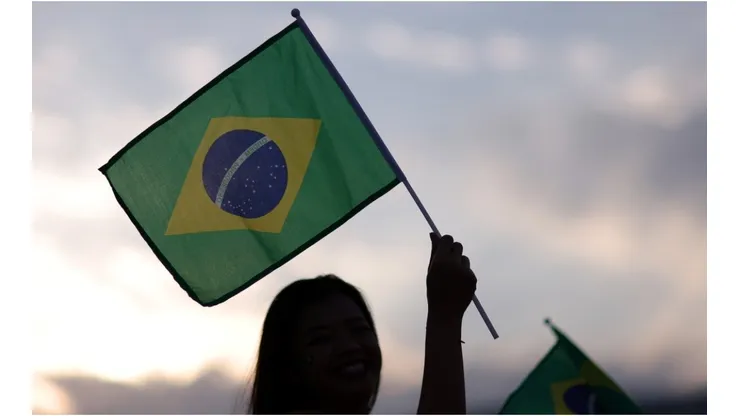 Fans wave a Brazil flag