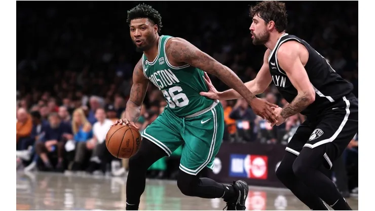 Marcus Smart #36 of the Boston Celtics drives against Joe Harris #12 of the Brooklyn Nets