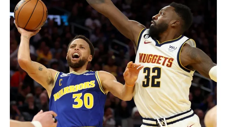 Stephen Curry of the Golden State Warriors and Jeff Green of the Denver Nuggets