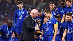 Gianni Infantino hands over the FIFA Club World Cup trophy to Cesar Azpilicueta of Chelsea following the FIFA Club World Cup UAE 2021 Final match
