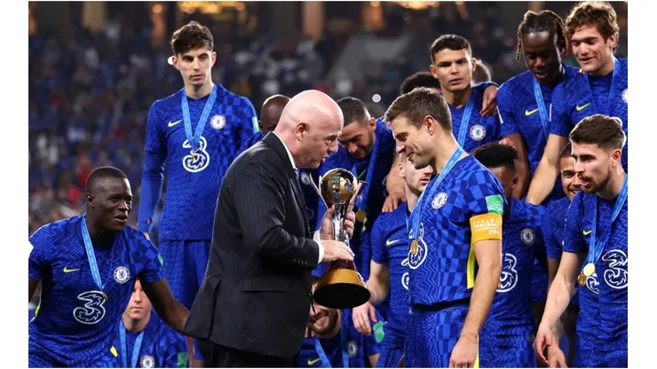 Gianni Infantino hands over the FIFA Club World Cup trophy to Cesar Azpilicueta of Chelsea following the FIFA Club World Cup UAE 2021 Final match