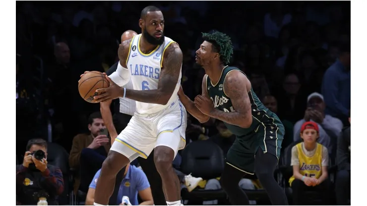LeBron James #6 of the Los Angeles Lakers post up Marcus Smart #36 of the Boston Celtics