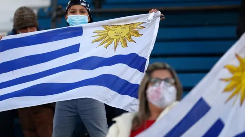 Fans of Uruguay wave flags