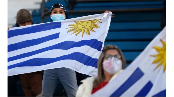 Fans of Uruguay wave flags
