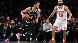 Ben Simmons #10 of the Brooklyn Nets drives against Evan Fournier #13 of the New York Knicks