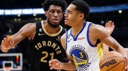 Thaddeus Young of the Toronto Raptors and Jordan Poole of the Golden State Warriors
