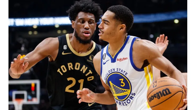 Thaddeus Young of the Toronto Raptors and Jordan Poole of the Golden State Warriors