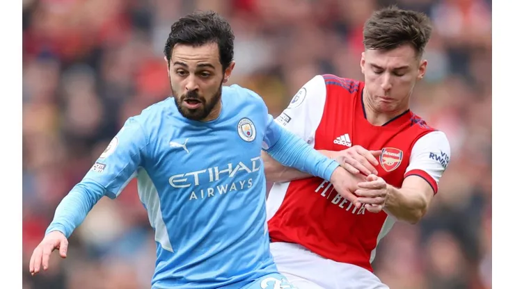 Bernardo Silva of Manchester City and Kieran Tierney of Arsenal