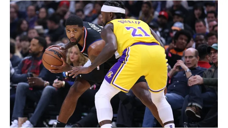 Paul George #13 of the LA Clippers is guarded by Patrick Beverley #21 of the Los Angeles Lakers