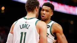 Brook Lopez #11 reacts with Giannis Antetokounmpo #34 of the Milwaukee Bucks