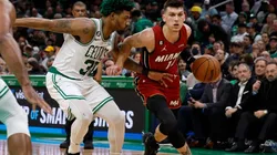 Tyler Herro #14 of the Miami Heat drives on Marcus Smart #36 of the Boston Celtics