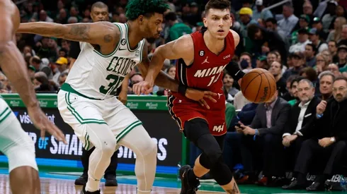 Tyler Herro #14 of the Miami Heat drives on Marcus Smart #36 of the Boston Celtics