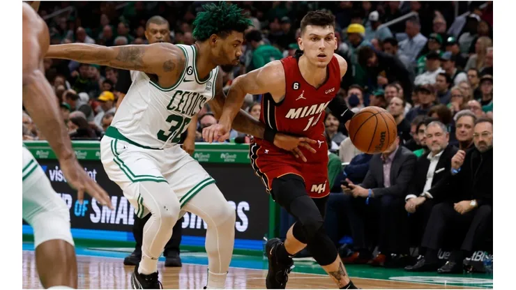 Tyler Herro #14 of the Miami Heat drives on Marcus Smart #36 of the Boston Celtics