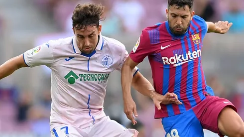 Jaime Mata of Getafe and Jordi Alba of Barcelona