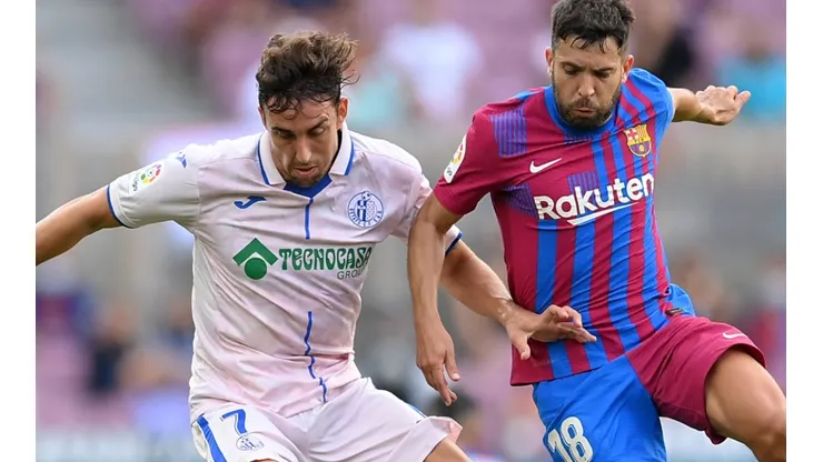 Jaime Mata of Getafe and Jordi Alba of Barcelona
