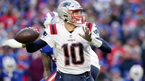 Mac Jones #10 of the New England Patriots attempts a pass.