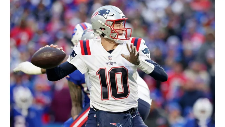 Mac Jones #10 of the New England Patriots attempts a pass.