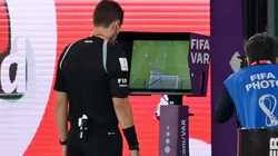 Referee making a VAR review at Qatar 2022.