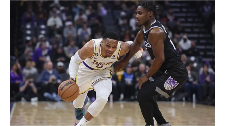 Russell Westbrook #0 of the Los Angeles Lakers drives to the basket against Davion Mitchell #15 of the Sacramento Kings