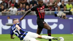 Milan Skriniar of FC Internazionale challenges Rafael Leao of AC Milan