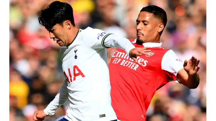 Son Heung-Min of Tottenham is challenged by William Saliba of Arsenal