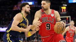 Nikola Vucevic #9 of the Chicago Bulls is guarded by Klay Thompson #11 of the Golden State Warriors