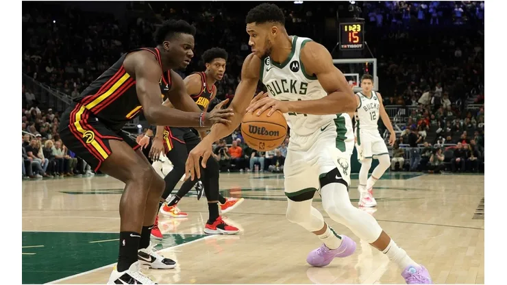 Giannis Antetokounmpo of the Milwaukee Bucks is defended by Clint Capela of the Atlanta Hawks