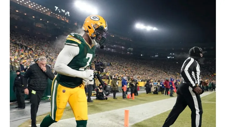 Quay Walker leaves the field after being disqualified against the Detroit Lions