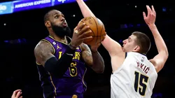 LeBron James of the Los Angeles Lakers takes a shot against Nikola Jokic of the Denver Nuggets