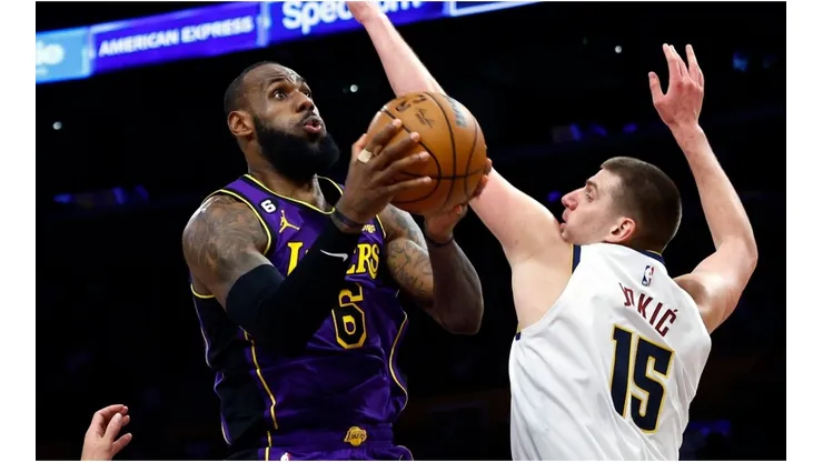 LeBron James of the Los Angeles Lakers takes a shot against Nikola Jokic of the Denver Nuggets