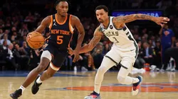 Immanuel Quickley of the New York Knicks drives to the net against George Hill of the Milwaukee Bucks