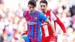 Gavi of Barcelona and Stefan Savic of Atletico Madrid