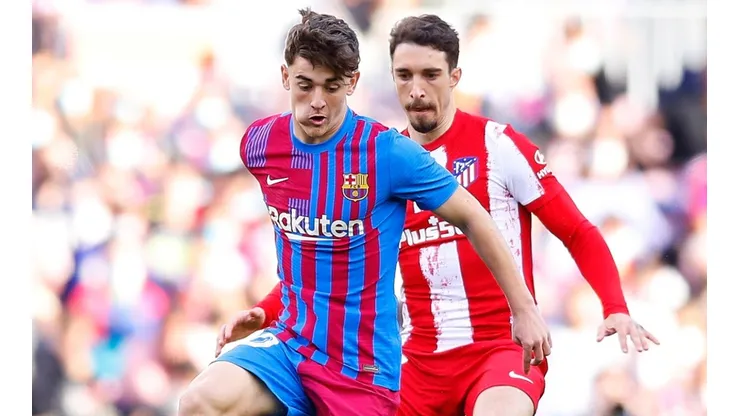 Gavi of Barcelona and Stefan Savic of Atletico Madrid