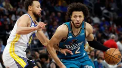 Cade Cunningham of the Detroit Pistons dribbles on Stephen Curry of the Golden State Warriors