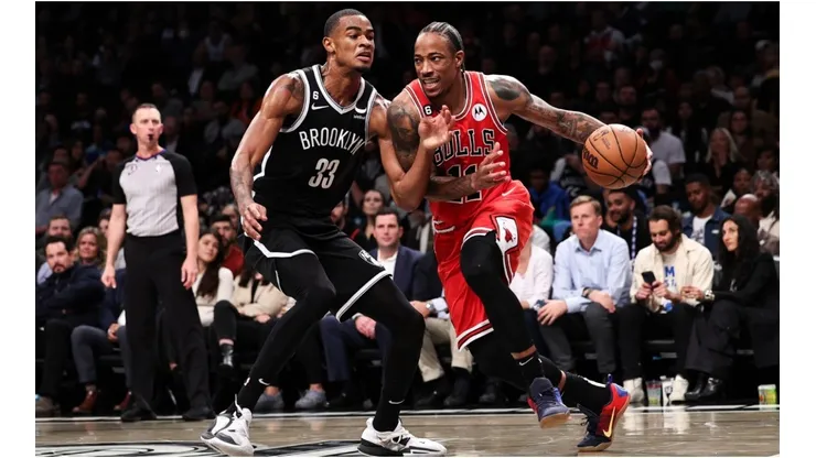 DeMar DeRozan of the Chicago Bulls is defended by Nicolas Claxton of the Brooklyn Nets