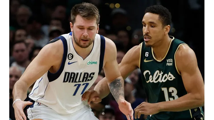 Luka Doncic of the Dallas Mavericks and Malcolm Brogdon of the Boston Celtics